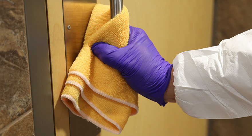 Wiping Door Handle with Sanitizing Wipes