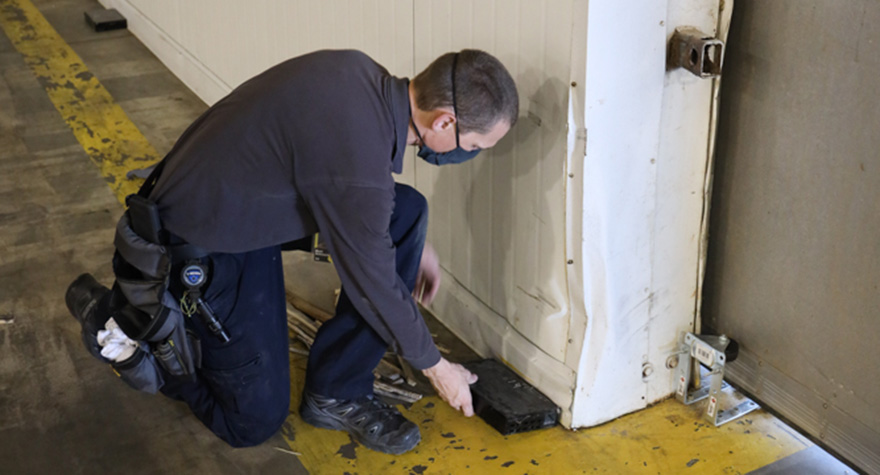 Technician Setting Mouse Traps